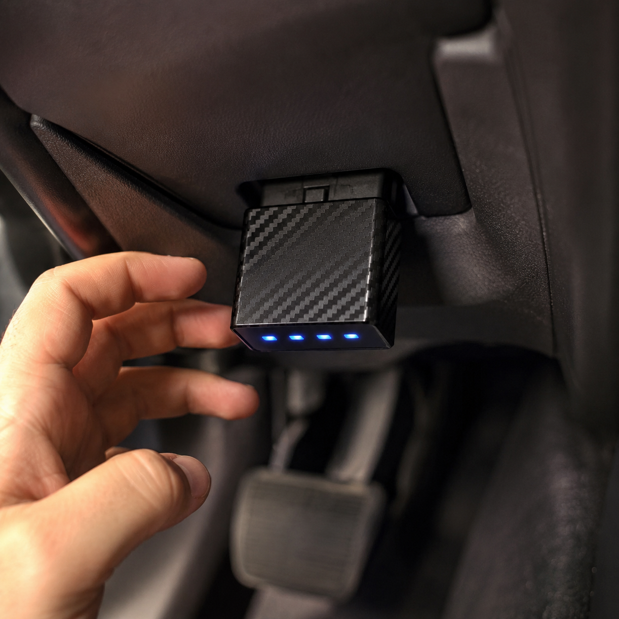 Plugging FullCyl into the OBD II port with blue LEDs lighting up